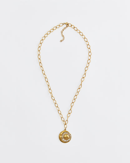 Gold necklace with a pendant on a white background